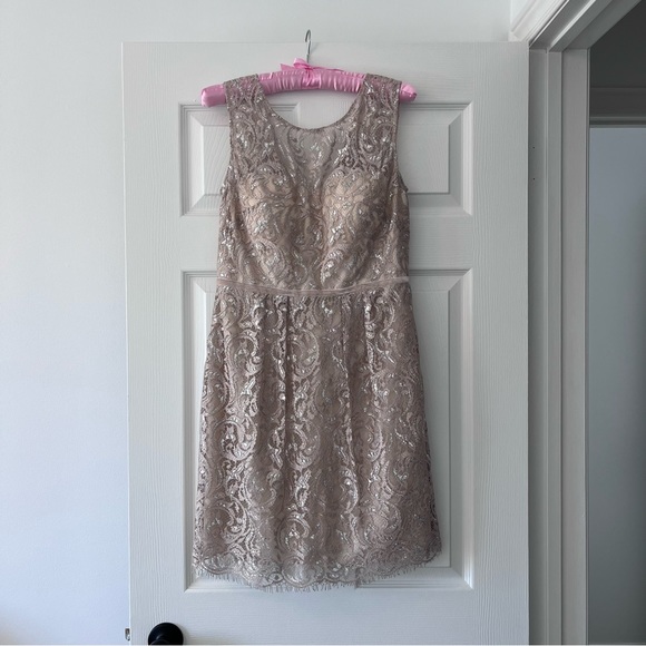 Stand out at holiday parties wearing this elegant Jenny Yoo cocktail dress. - Picture 1 of 3